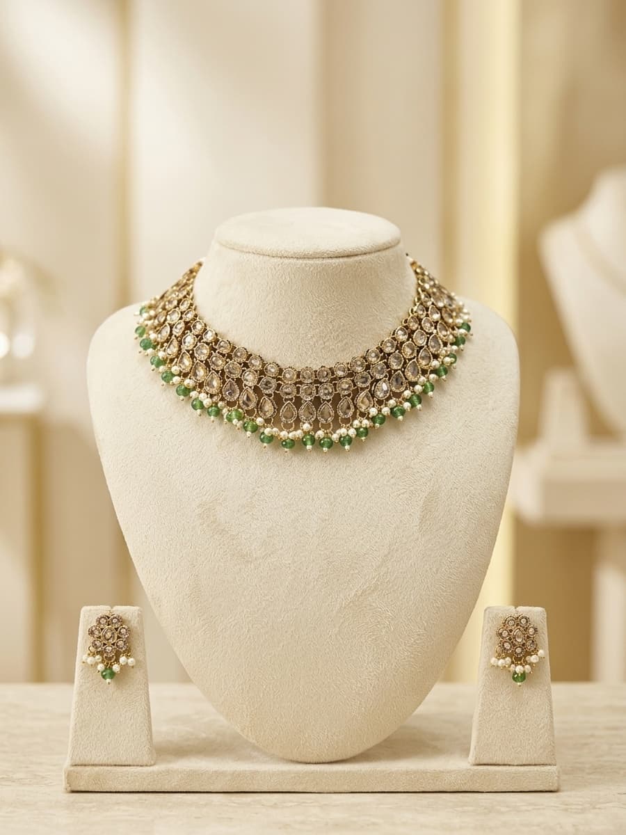 Polki Choker with Emerald Bead Drops and Matching Studs on Ivory Bust